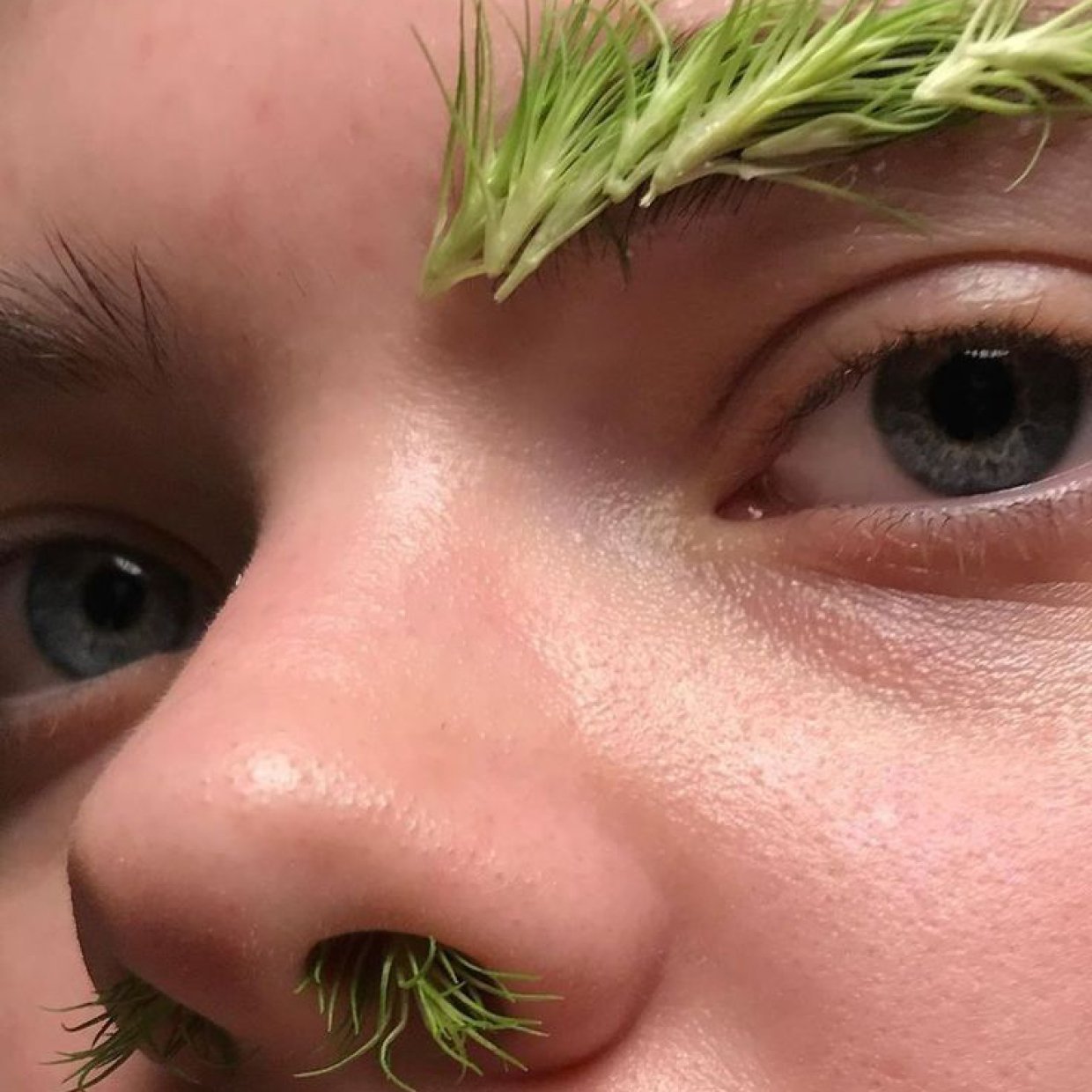 Image of a woman with flowers in her hair, representing Coupe Coupe's connection to nature.