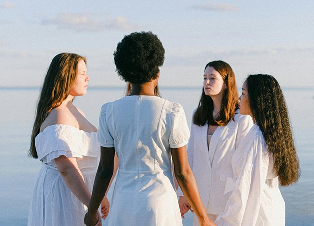 Group of women in white outfits